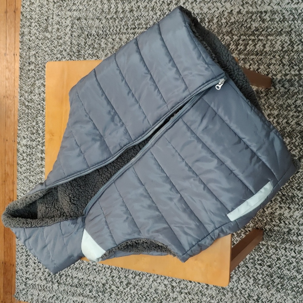 Full zip vest with hood and pockets.